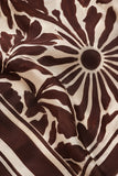 ASTR the Label Clothing Eva Top Style ACT19474 in Brown Tropical. Macro view of the lightweight woven fabric showing the chocolate brown botanical print, ivory background, and border detailing.