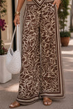 ASTR the Label Eva Pant Style ACP7429 in Brown Tropical. Close-up of the wide leg pant highlighting the statement border print and full-length hem.