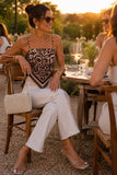 ASTR the Label Clothing Eva Top Style ACT19474 in Brown Tropical. Woman wearing the Eva Pointed Hem Spaghetti Strap Tank Top styled with white wide leg jeans for a golden hour dinner in the Hudson Valley.