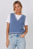 Central Park West Clothing Coen Cable X CNS Layered Sweater Style CF26-10681K in Denim White. Woman wearing blue cable-knit layered sweater vest with white tee insert and light wash jeans