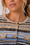 Central Park West Clothing Marlon Textured Stitch Cardigan Style CU26-10625S in Brown Blue Multi; Woman wearing the Marlon textured striped button-front cardigan with blue jeans.