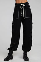 A pair of Chaser Billy Shadow Black Jogger Pants featuring contrast stitching, side cargo pockets, an elastic waist, and deep front pockets. The joggers are shown paired with the matching Cooper Shadow Black Top, creating a stylish and comfortable ensemble. Style Number CW9769-SHDW