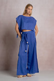 Elan Clothing Side Slit Beaded Tie Waist Linen Pant Style LL2391 in sapphire blue. a women's linen summer side leg slit beaded tie waist pant.