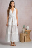 Elan Clothing Soyrara Halter Maxi Dress Style VCL50197 in White. Viscose blend white midi dress with tired eyelet skirt details, halter neck and tie waist for shaping