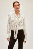 Fifteen Twenty tie neck top in ivory chain link print Italian crepe fabric, featuring soft tie at V-neck and billowy blouson sleeves for an elegant and modern look. Style Number 3F30548 Prt