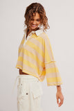 Free People Clothing Auggie Tee Style OB2522317 in Oat Latte Yellow Finch. Women's Cotton striped slouchy polo style pullover spring summer top.