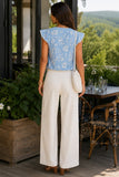 Generation Love Clothing Arden Lace Combo Floral Voile Blouse Heritage Toile Style W02654649 In Heritage Blue with White. Woman in a blue floral lace blouse and ivory wide-leg trousers with friends at a scenic winery lunch, styled with cognac block heel sandals and a woven shoulder bag.