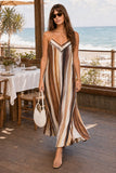 Greylin Clothing Stella Vertical Watercolor Maxi Dress Style G266D7133 in Mustard Brown Neutral Stripe. Front walking view of the Stella Watercolor Maxi Dress showing its lightweight, flowing silhouette