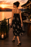 Greylin Clothing Paige Layered Ruffle Midi Dress Style G264D7178 in Midnight. Woman walking in the Paige tiered midi dress showing beautiful movement and fluid ruffle layers.