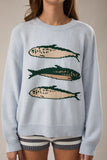 Le Lis Clothing Sardine Sweater Top Style SWT3466 in baby blue. Baby Blue Cotton blend relaxed fit Spring crew neck sweater with sardines graphic.