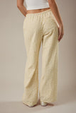 Le Lis Collection Low Rise Wide Leg Striped Cotton Woven Pant Style SP3372 in White Yellow Stripe. Women's all cotton woven striped low rise tie waist wide leg spring summer pant.