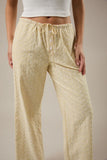 Le Lis Collection Low Rise Wide Leg Striped Cotton Woven Pant Style SP3372 in White Yellow Stripe. Women's all cotton woven striped low rise tie waist wide leg spring summer pant.