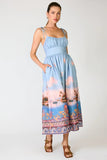 Line and Dot Clothing Pernille Maxi Dress Style LD6071B in Blue Multi. Tie adjustable spaghetti strap partial smocked back summer tropical landscape print maxi dress