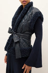 Marie Oliver Clothing BEATRICE VEST Style 855-306B-108 in Naval Blue; Quilted Vegan Leather Vest; Navy Blue Sherpa Trim Belted Fall/Winter Vest