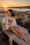 Pink Pineapple Chloe Flag Sailboat Roll Neck Sweater in Cream. Women's cotton light weight rollneck flag sailboat beachy summer sweater