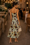 Back view of the Dolly floral ruched mesh midi dress highlighting the adjustable spaghetti straps, fitted ruched bodice, and flowing drop waist silhouette. Rails Clothing Dolly Dress Style 566-103H-8745 in Plumeria