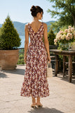 Back view of a floral midi dress featuring a V-back neckline, smocked empire waist, flowing skirt, and clear strap kitten heel sandals. Rails Clothing Marciana Dress Style 913A-191G-8768 in Cardinal Floral