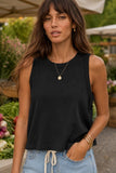 Rails Clothing The Boxy Tank Style 813-383A-001 in Black. Woman wearing the Boxy Tank in Black, a cropped 100% cotton sleeveless top with a crew neckline and wide shoulder straps.