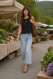 Rails Clothing The Boxy Tank Style 813-383A-001 in Black. Woman wearing a black cotton boxy tank during a casual warm-weather outing.