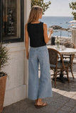 Rails Clothing Akira Top Style 229-615C-001 in black; Back view of Rails Akira black linen top with light wash wide leg cropped jeans