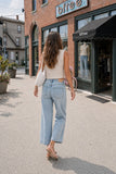 Women’s light-wash cropped wide-leg jeans, Mid-rise jeans with an adjustable shoelace belt, Summer jeans with subtle sun artwork, ’90s-inspired California-style denim, Relaxed wide-leg jeans for shopping and brunch, Statement denim that still feels easy to wear, Cropped jeans to wear with kitten heels, Light-wash jeans for a summer vacation, Jeans that pair with cropped knit tops, Casual boutique outfit for women over 40, Comfortable rigid-look denim with slight stretch, True-to-size cropped wide-leg jeans.