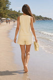 Varley Marla Button Placket Tank Style VAR03162 ANIF in Anise Flower. Back view of the Marla Tank and Atrium shorts during a barefoot shoreline walk