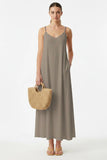 Vava By Joy Han Pom-Pom Maxi Sleeveless Dress Style VAVD119895 in Taupe. Taupe summer maxi dress with pom-pom detail adjustable spaghetti straps. Perfect for warm weather gatherings
