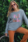 “Fall Babe” sweater in cement grey with “Fall Babe” text knitted in fall colors. Relaxed fit, ribbed crew neck, hem, and sleeve edges. Perfectly pairs with jeans for cozy autumn style.  Style Number K51Y2W931